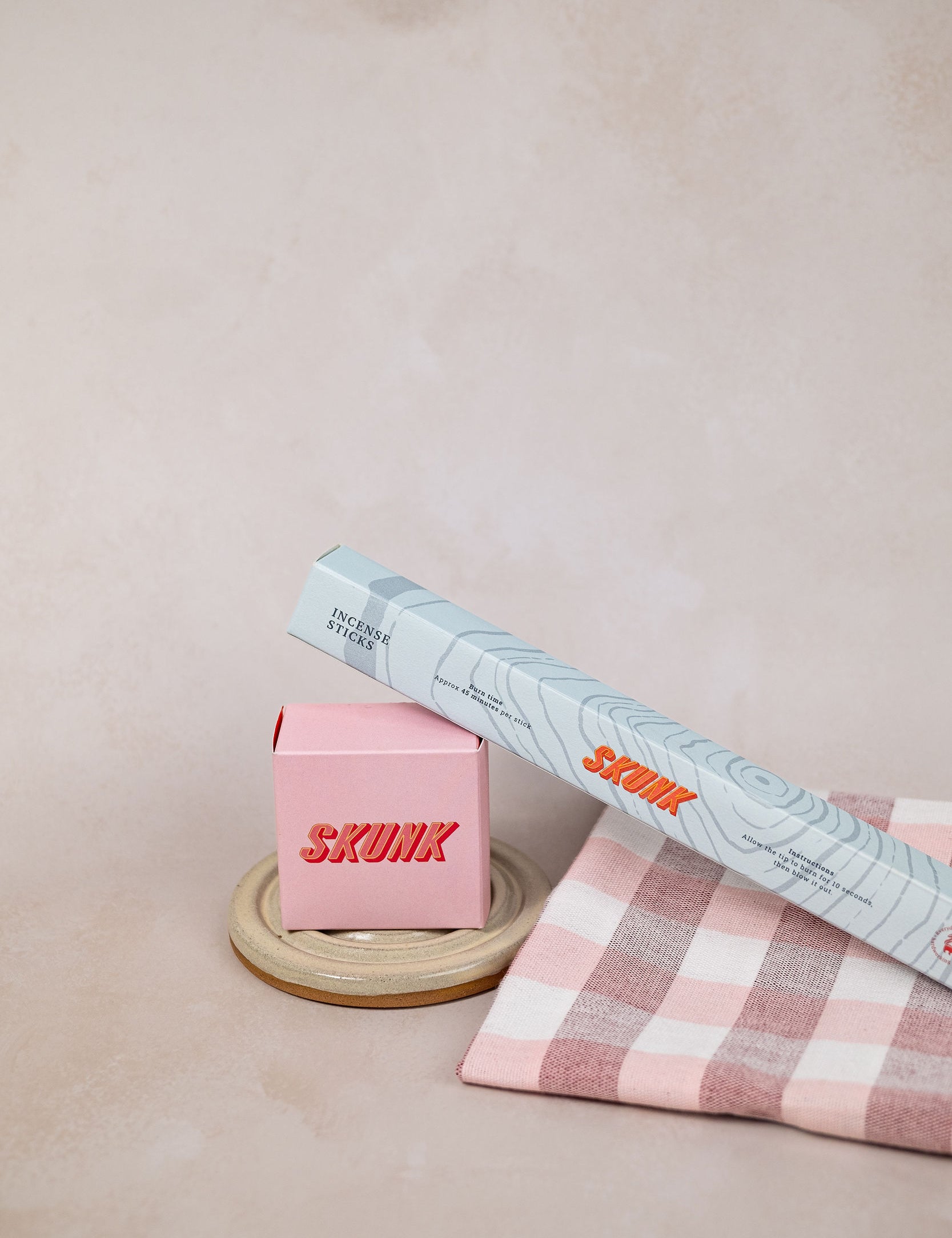 The Home Ritual gift set by Skunk Goods Trading, with natural soap, a ceramic soap dish, incense sticks and a handwoven tea towel