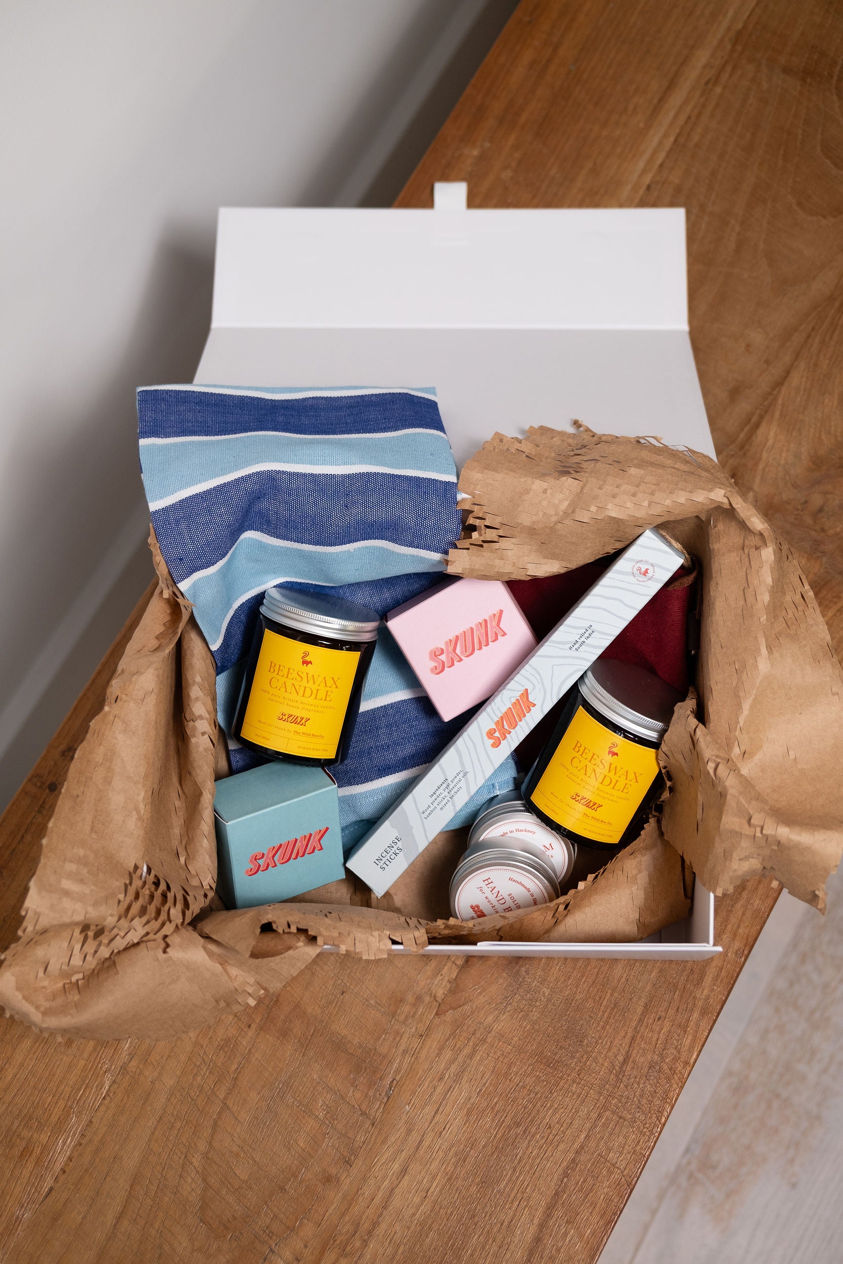 Exclusive gift box featuring cold process soap, Beeswax Candle, natural hand balm. Ideal for gifting season