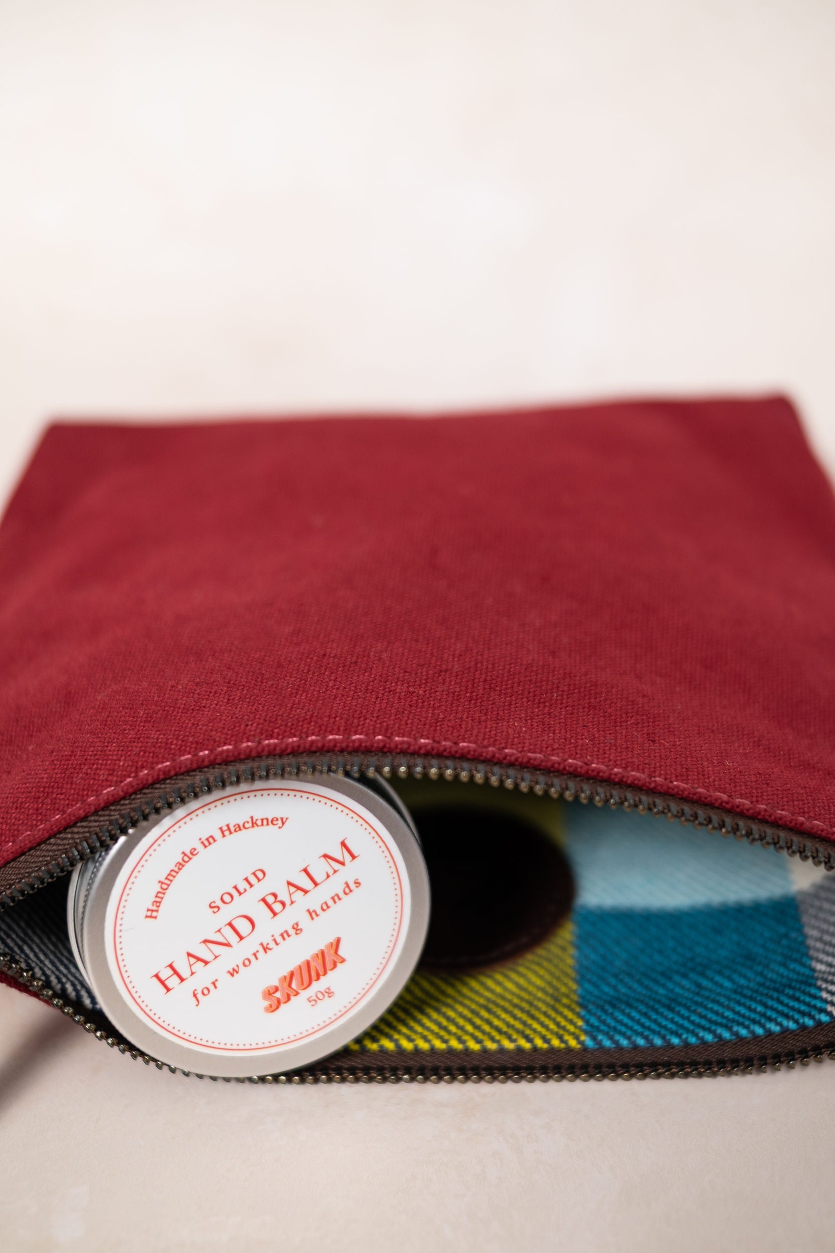 Maroon canvas pouch + soap + handbalm