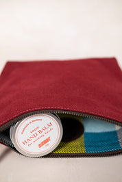 Maroon canvas pouch + soap + handbalm