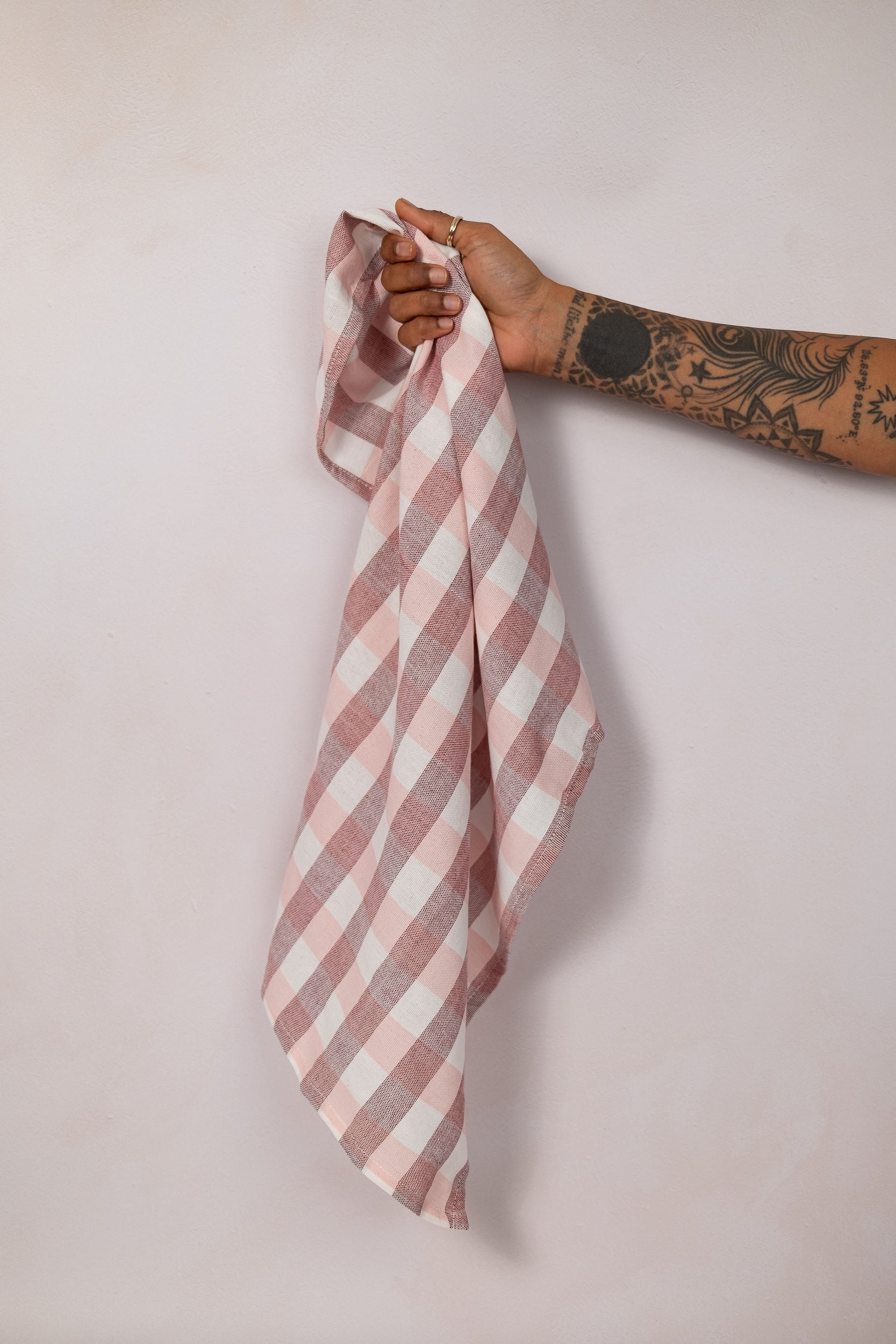 Pink and white check tea towel