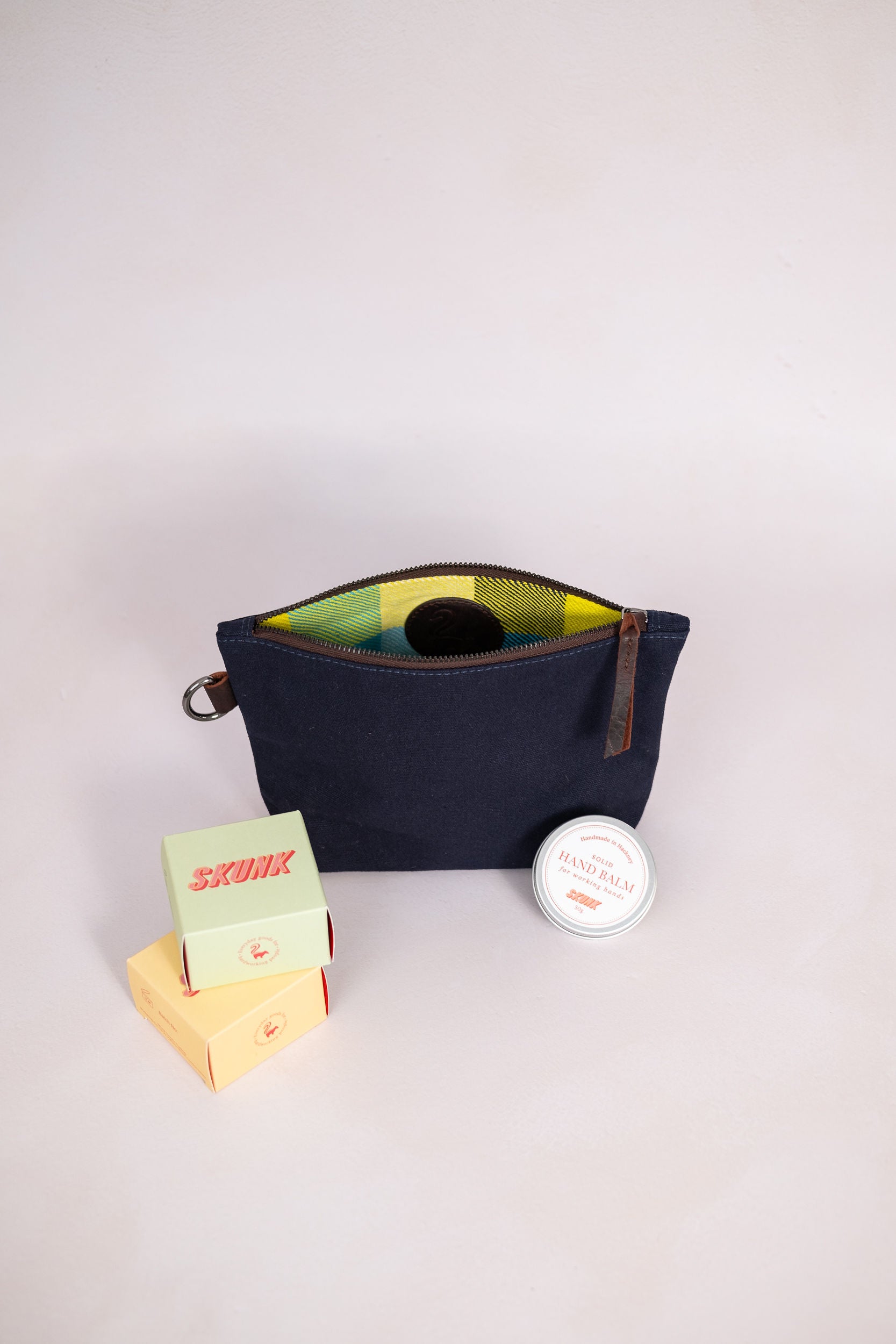 Canvas pouch in navy with soap and balm