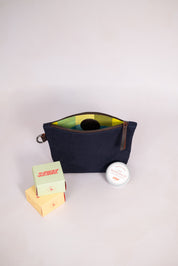 Canvas pouch in navy with soap and balm