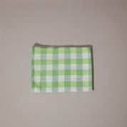 Green and white tea towel