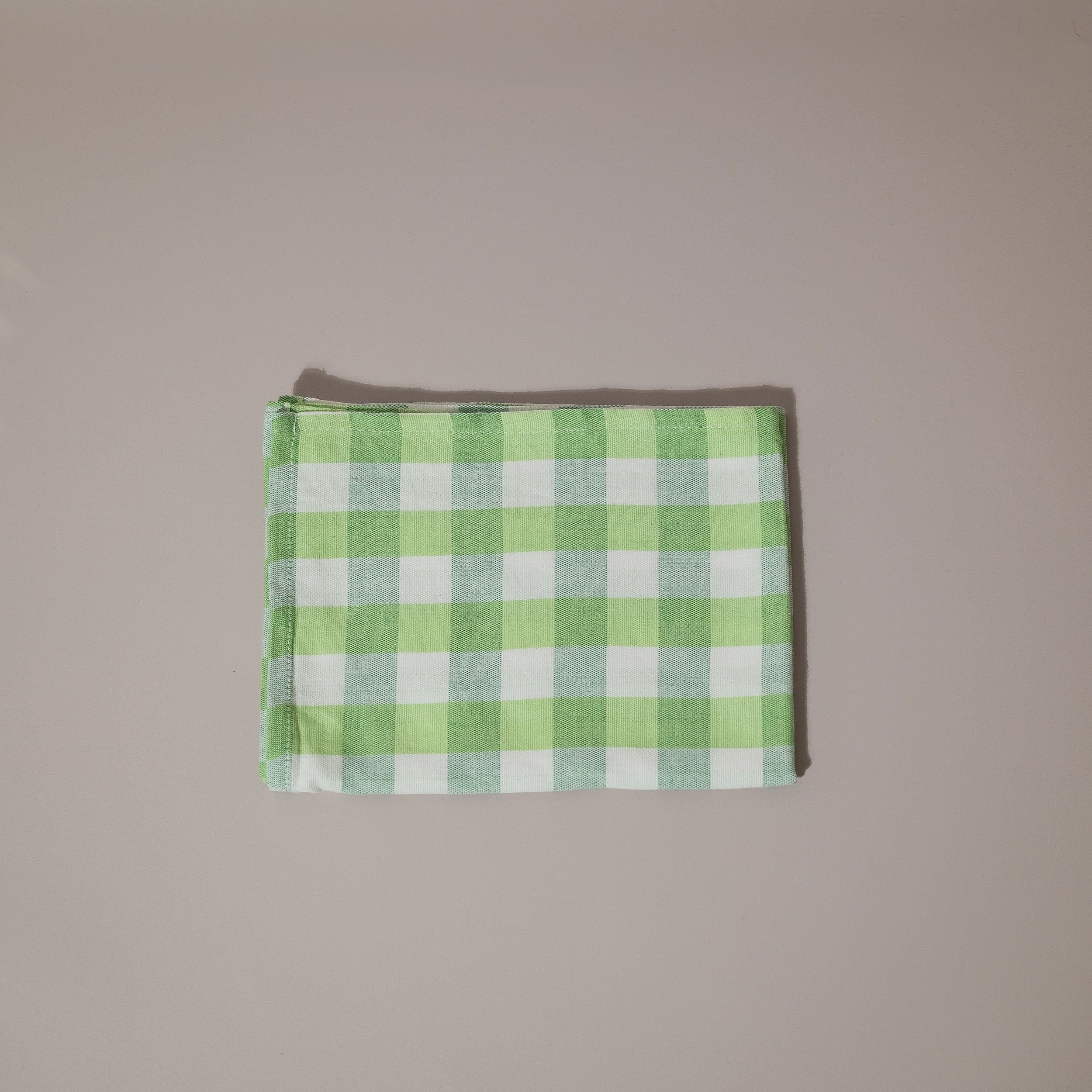 Green and white tea towel