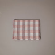 Pink and white check tea towel