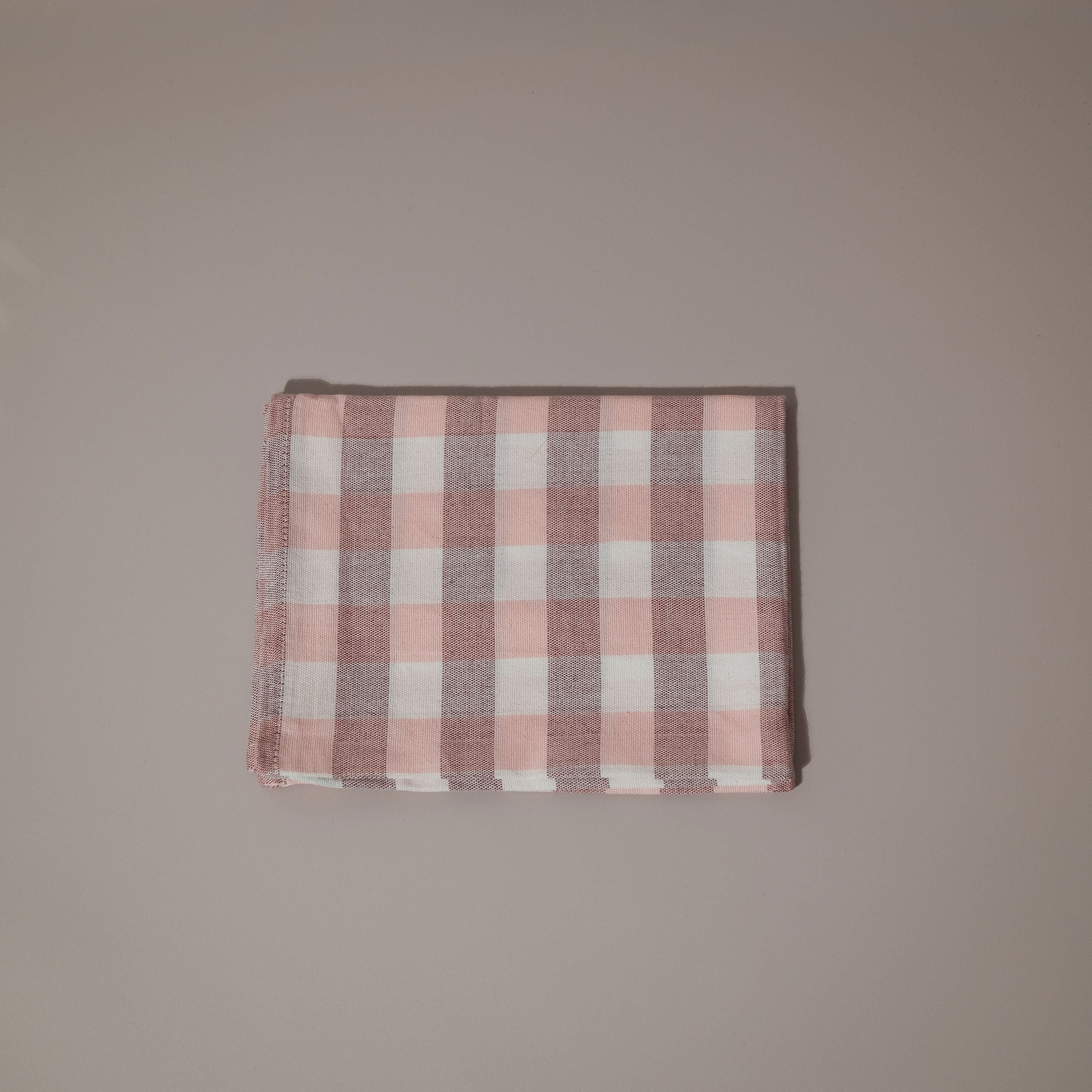 Pink and white check tea towel